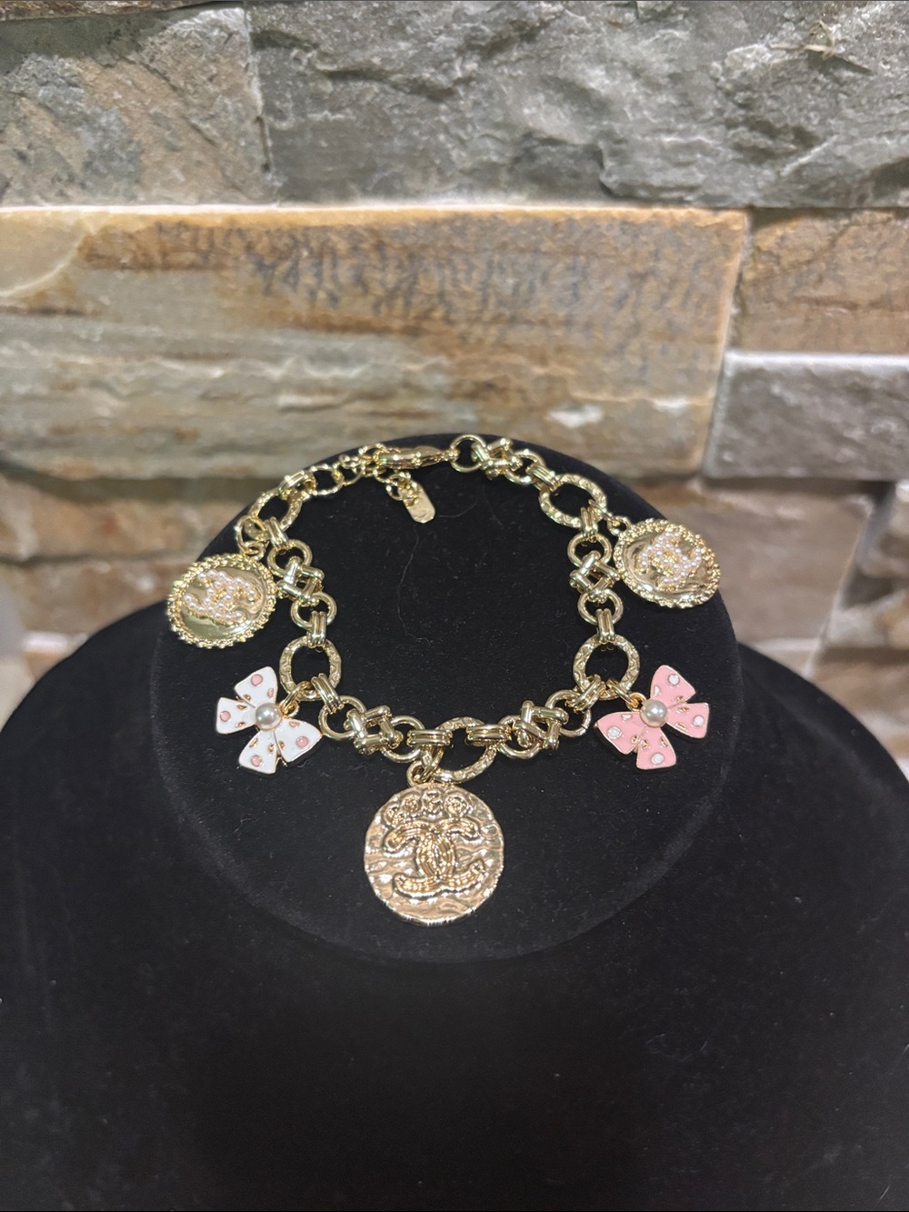 Gold plated Charm Bracelet with Pink & White Enamel Bows